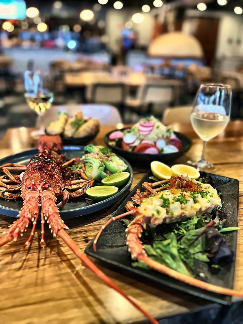 Grilled crayfish with salads and a glass of white wine